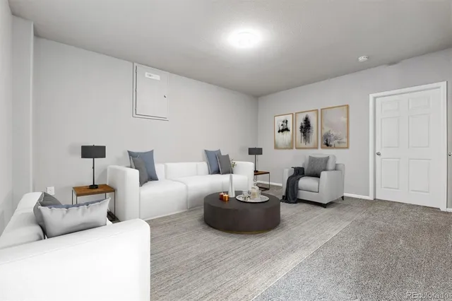 a living room with furniture and a lamp