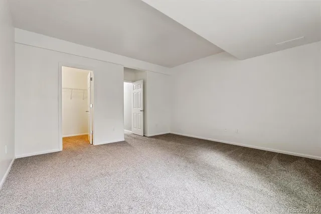 an empty room with closet area