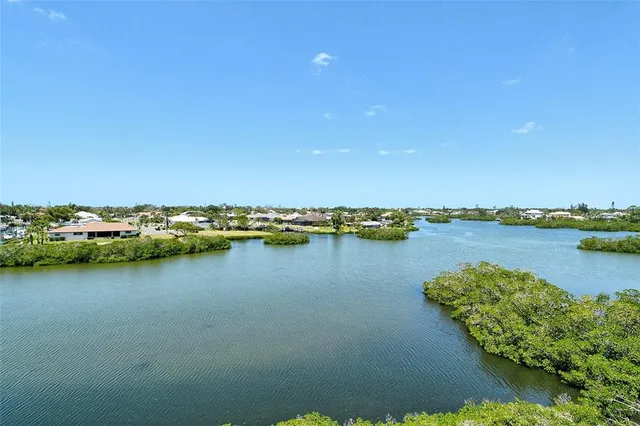 a living room with furniture a rug and white walls