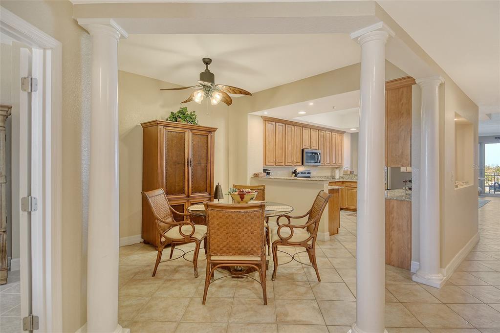 5100 Jessie Harbor Drive, Unit 504 Osprey, FL 34229 - Photo 27 of 87 a dining room with furniture and window