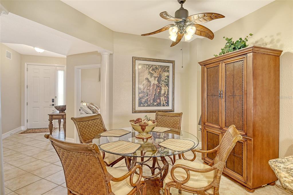 5100 Jessie Harbor Drive, Unit 504 Osprey, FL 34229 - Photo 28 of 87 a view of a dining room with furniture and chandelier
