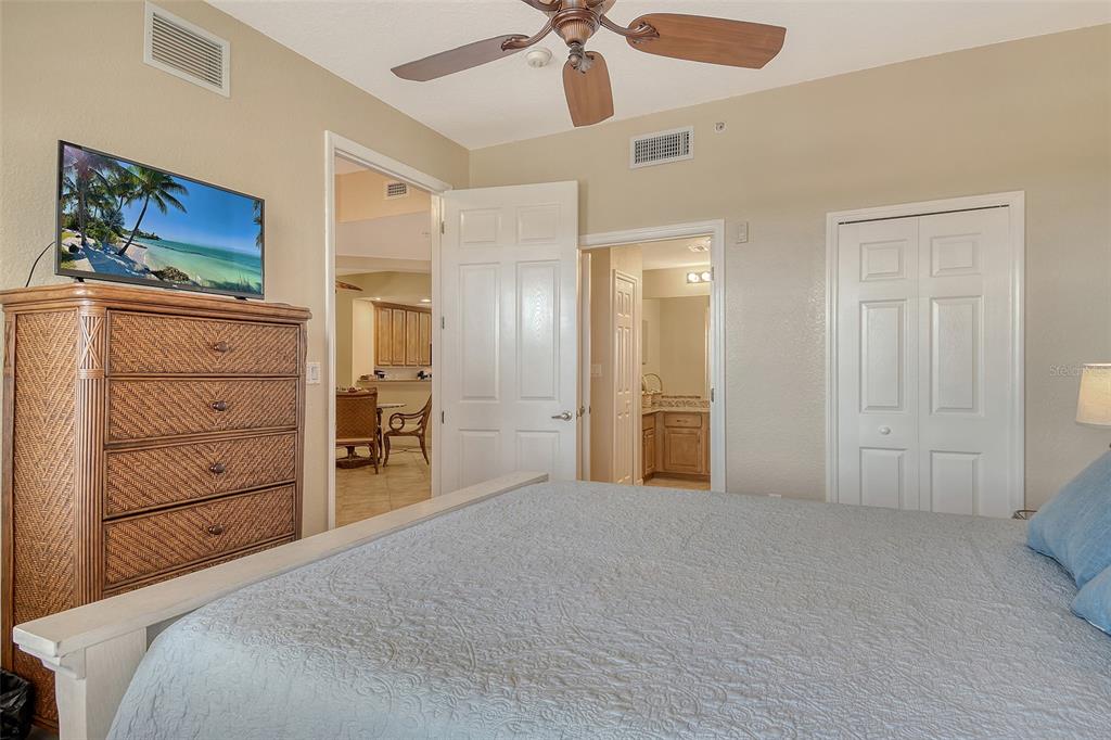5100 Jessie Harbor Drive, Unit 504 Osprey, FL 34229 - Photo 43 of 87 a bedroom with a bed and a dresser