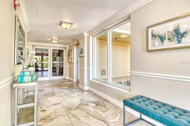 a view of a hallway with dining area