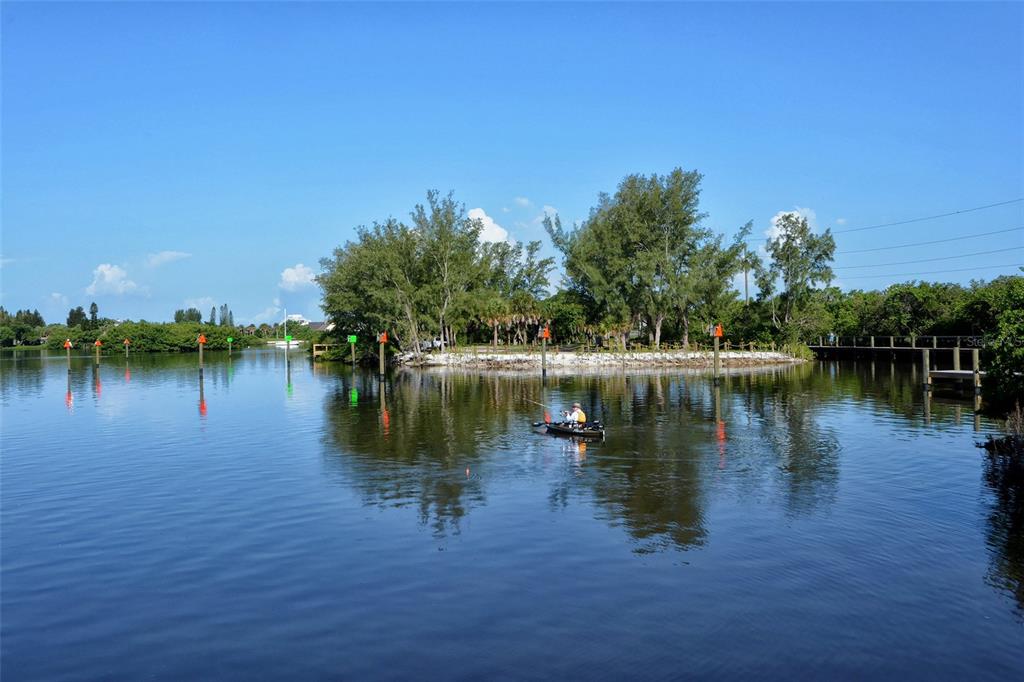 5100 Jessie Harbor Drive, Unit 504 Osprey, FL 34229 - Photo 63 of 87 a view of a lake with houses in the back