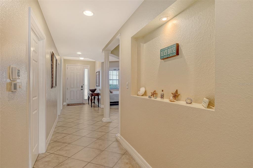 5100 Jessie Harbor Drive, Unit 504 Osprey, FL 34229 - Photo 7 of 87 a view of a hallway with dining area