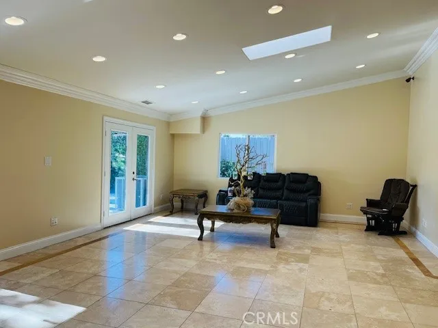 a bedroom with a bed and a chair