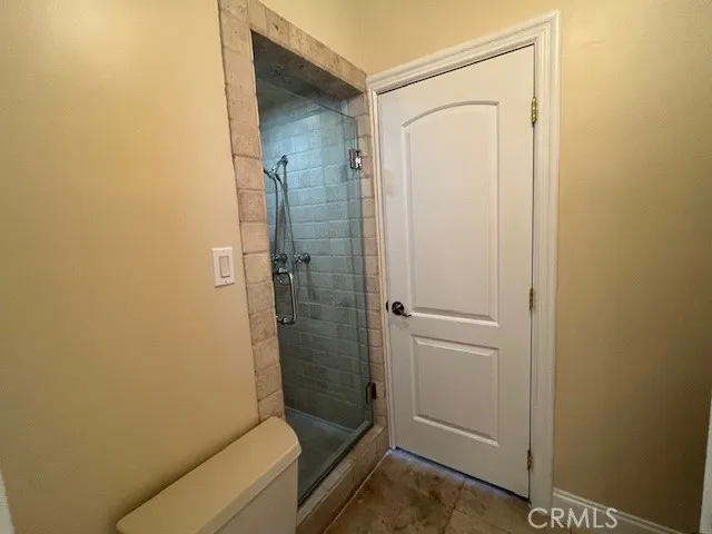 a bathroom with a toilet a sink and a mirror