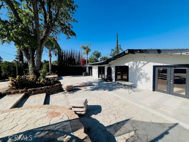 a view of a backyard with a sitting area and furniture