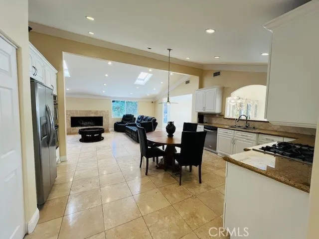 a utility room with stainless steel appliances washer and dryer