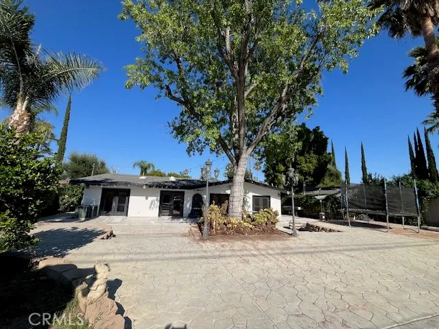 a view of a house with backyard porch and sitting area