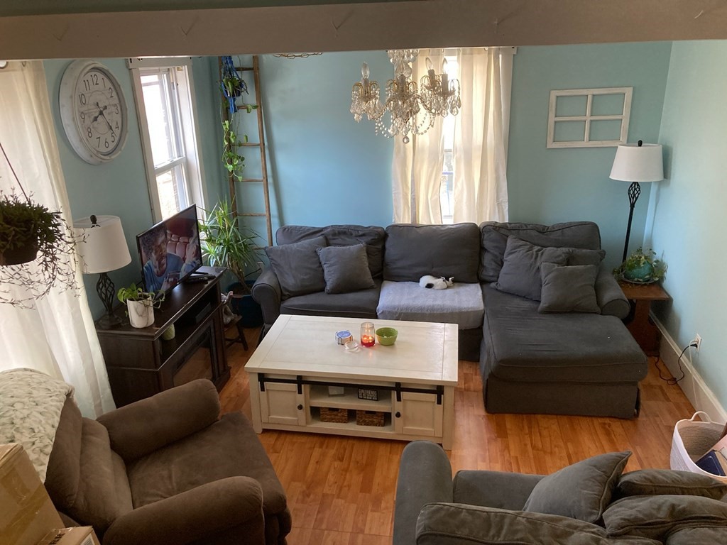 45 Maple Street Warren, MA 01083 - Photo 2 of 20 a living room with furniture and a large window