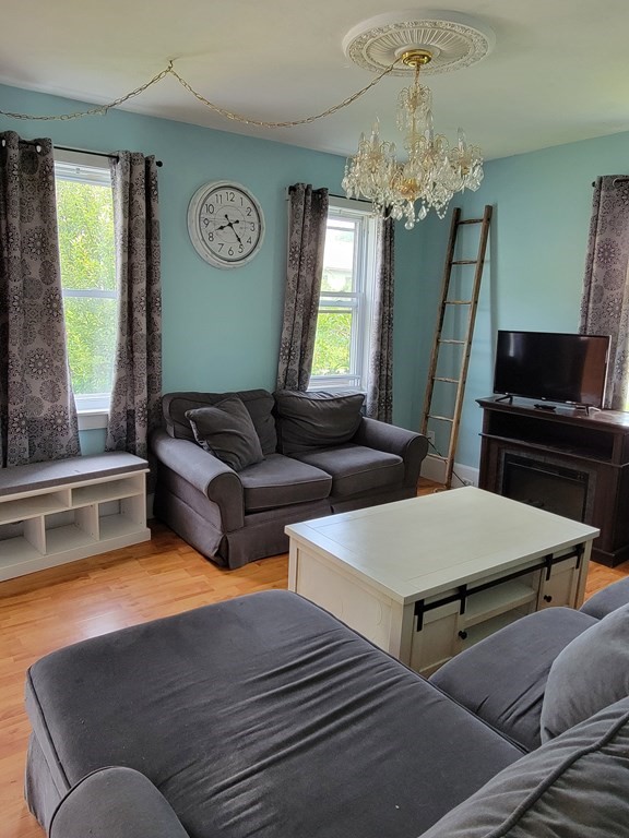 45 Maple Street Warren, MA 01083 - Photo 4 of 20 a living room with furniture and a large window