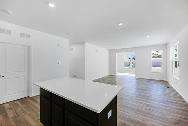 an empty room with wooden floor