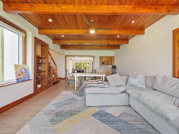 a bedroom with furniture and a wooden floor