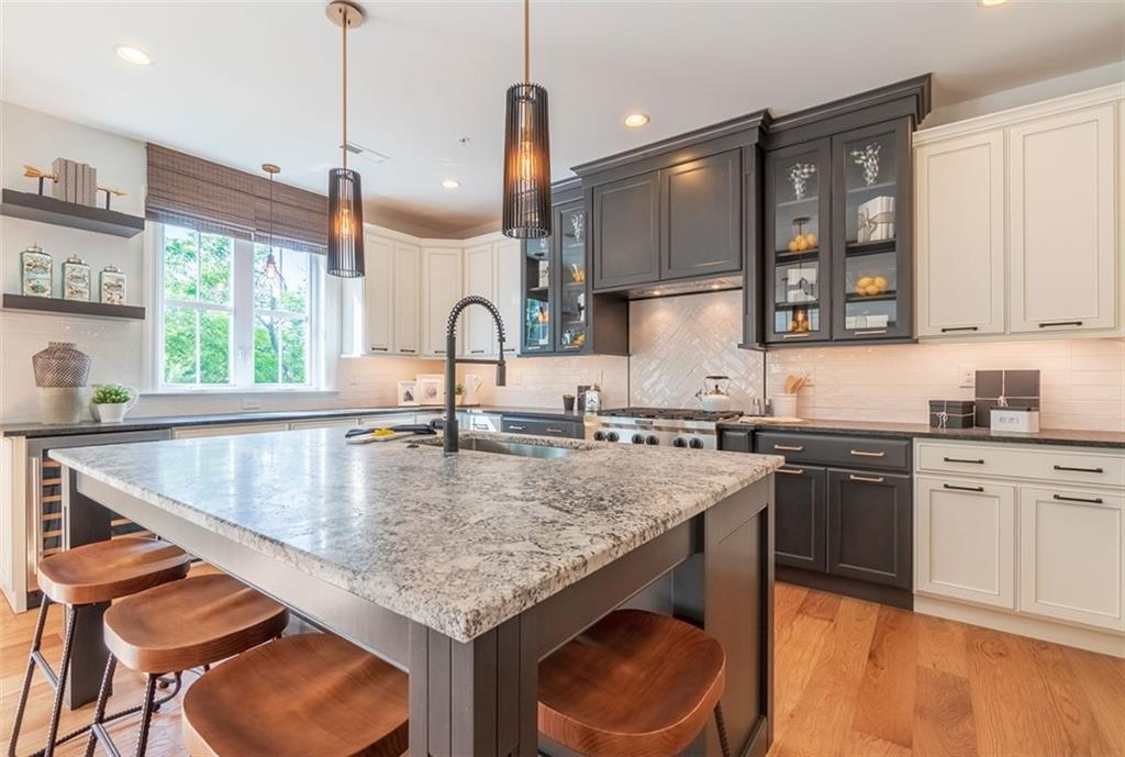 421 Johnston Road Pittsburgh, PA 15241 - Photo 4 of 16 a kitchen with granite countertop a sink a counter space appliances and cabinets