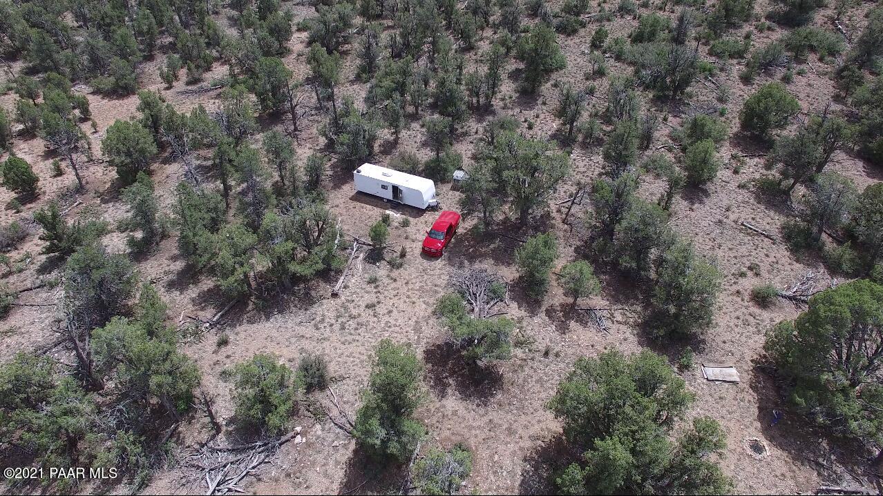 138 Arizona Road Ash Fork, AZ 86320 - Photo 6 of 20 Aerial of trailer and fire ring