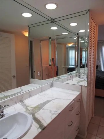 a bathroom with a sink double vanity and a mirror