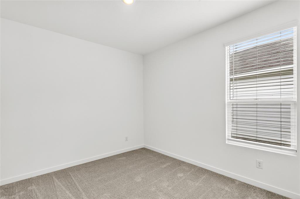 656 Waymaker Way Princeton, TX 75407 - Photo 11 of 40 Neutral color palette featuring light gray carpet flooring and white walls