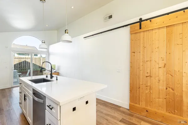 a kitchen with a sink and a refrigerator