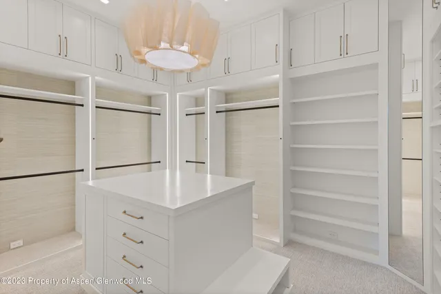 a view white cabinets and refrigerator
