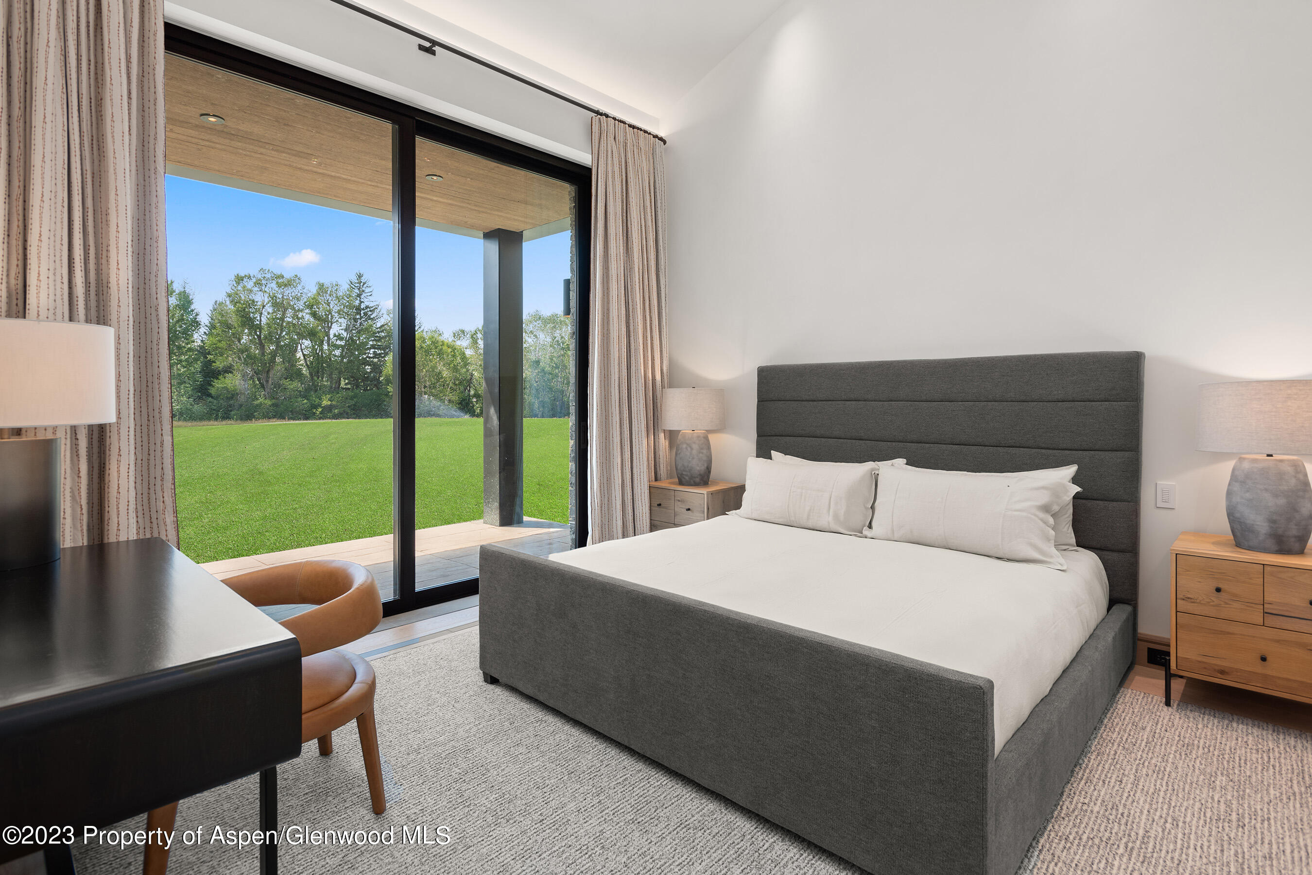 245 Slalom Path Aspen, CO 81612 - Photo 26 of 34 a room with a bed and a large window