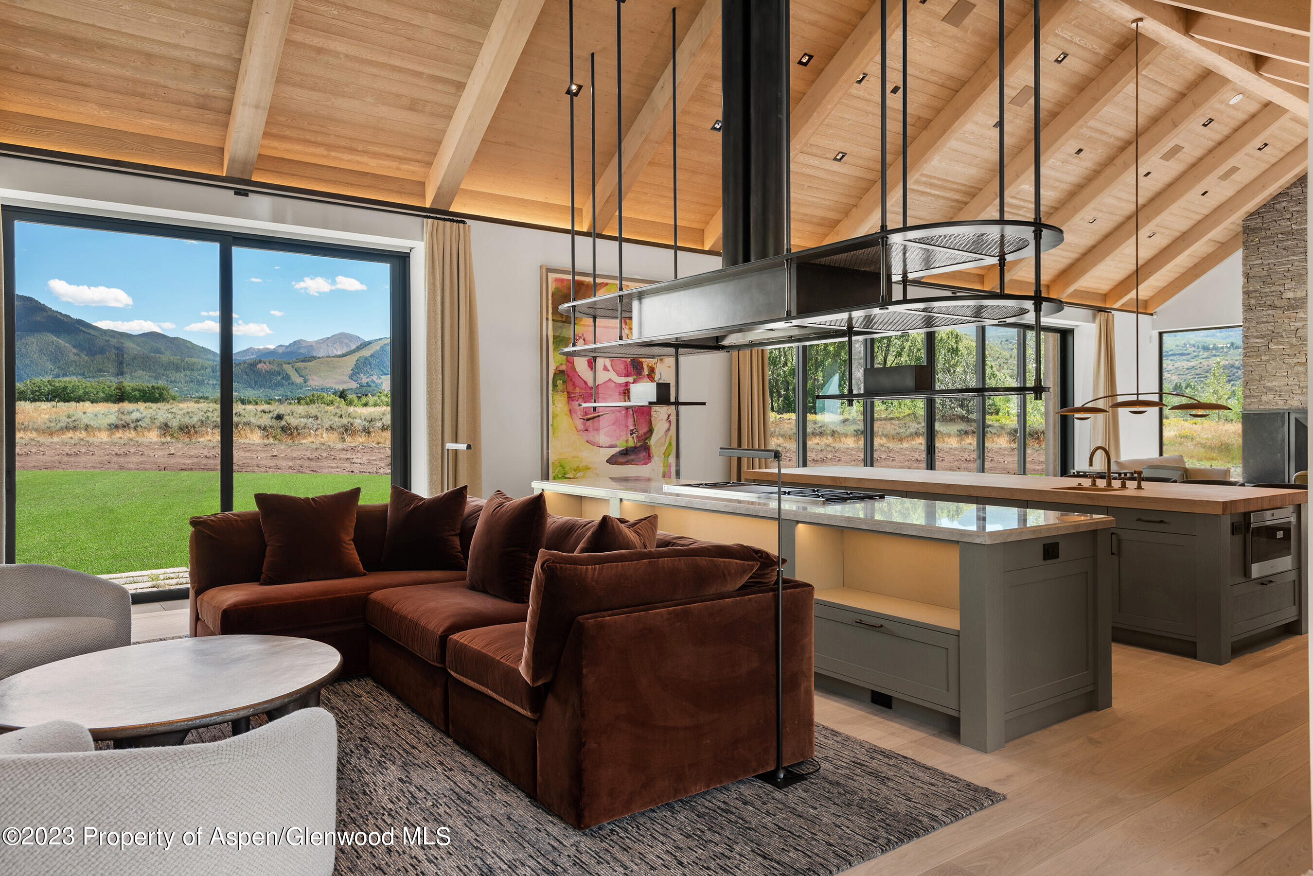 245 Slalom Path Aspen, CO 81612 - Photo 8 of 34 a living room with furniture and a large window