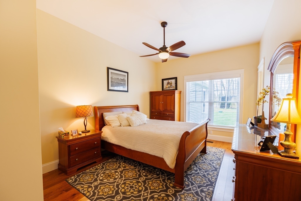 1776 Old Turnpike Road Oakham, MA 01068 - Photo 19 of 42 a bedroom with a bed and wooden floor