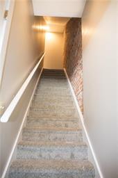 344 Bushkill Street, Unit 2 Easton, PA 18042 - Photo 5 of 30 Ascend to comfort with soft, carpeted stairs leading to the upper level.