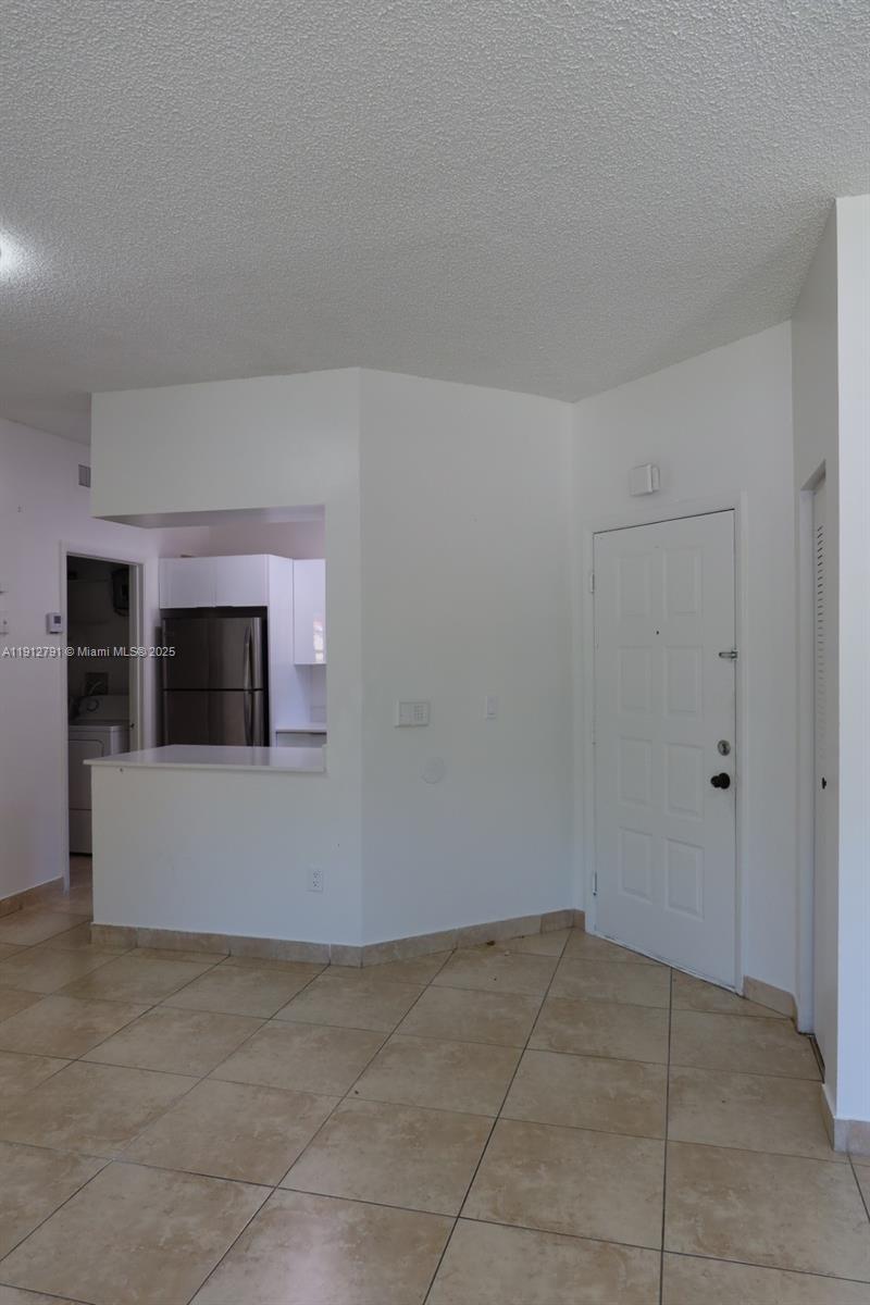 18340 Northwest 68th Avenue, Unit A Hialeah, FL 33015 - Photo 2 of 10 a view of an empty room