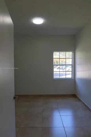 an empty room with closet area