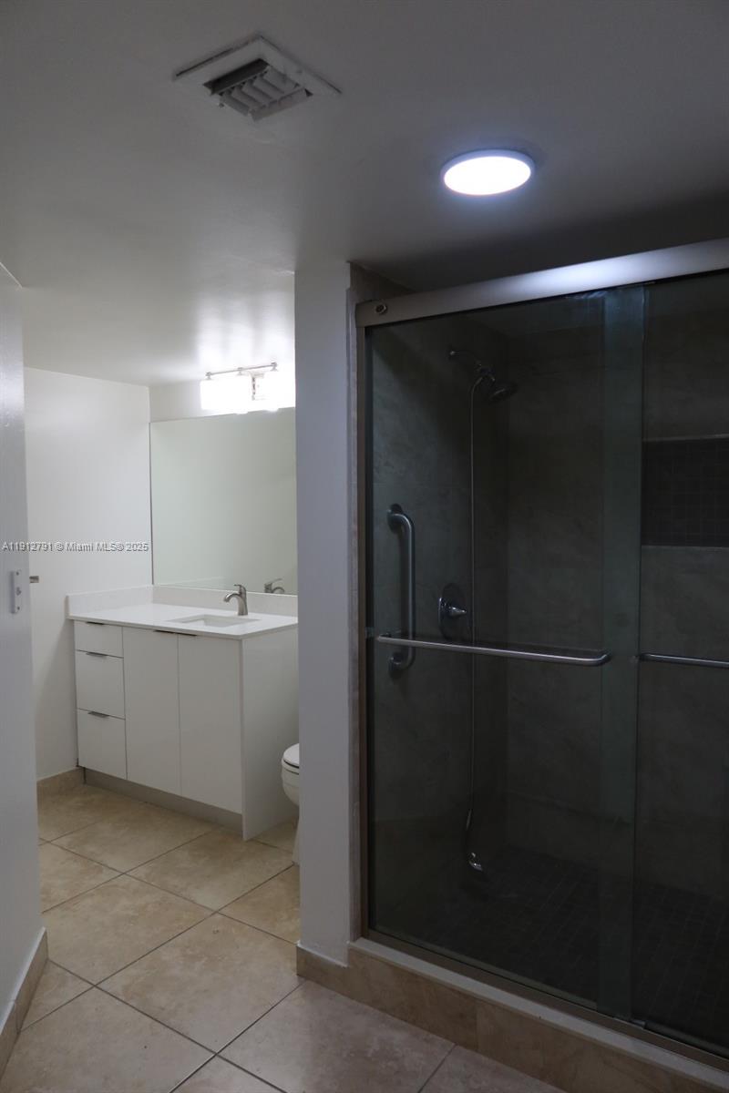 18340 Northwest 68th Avenue, Unit A Hialeah, FL 33015 - Photo 10 of 10 a bathroom with a shower and a sink