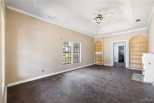 a view of an empty room with a window
