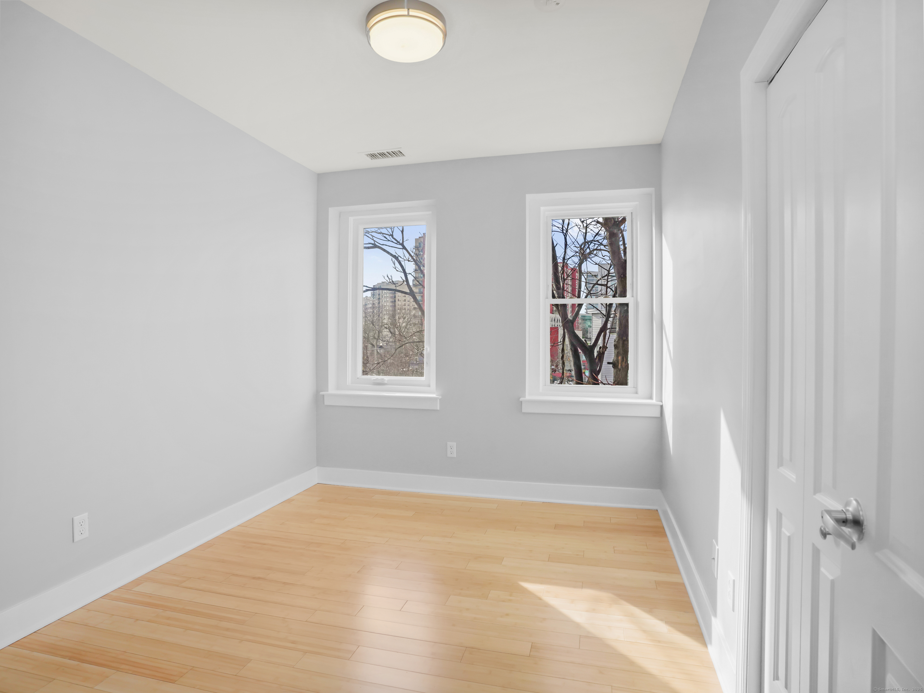 775 Atlantic Street, Unit R2 Stamford, CT 06902 - Photo 12 of 18 a view of empty room with window