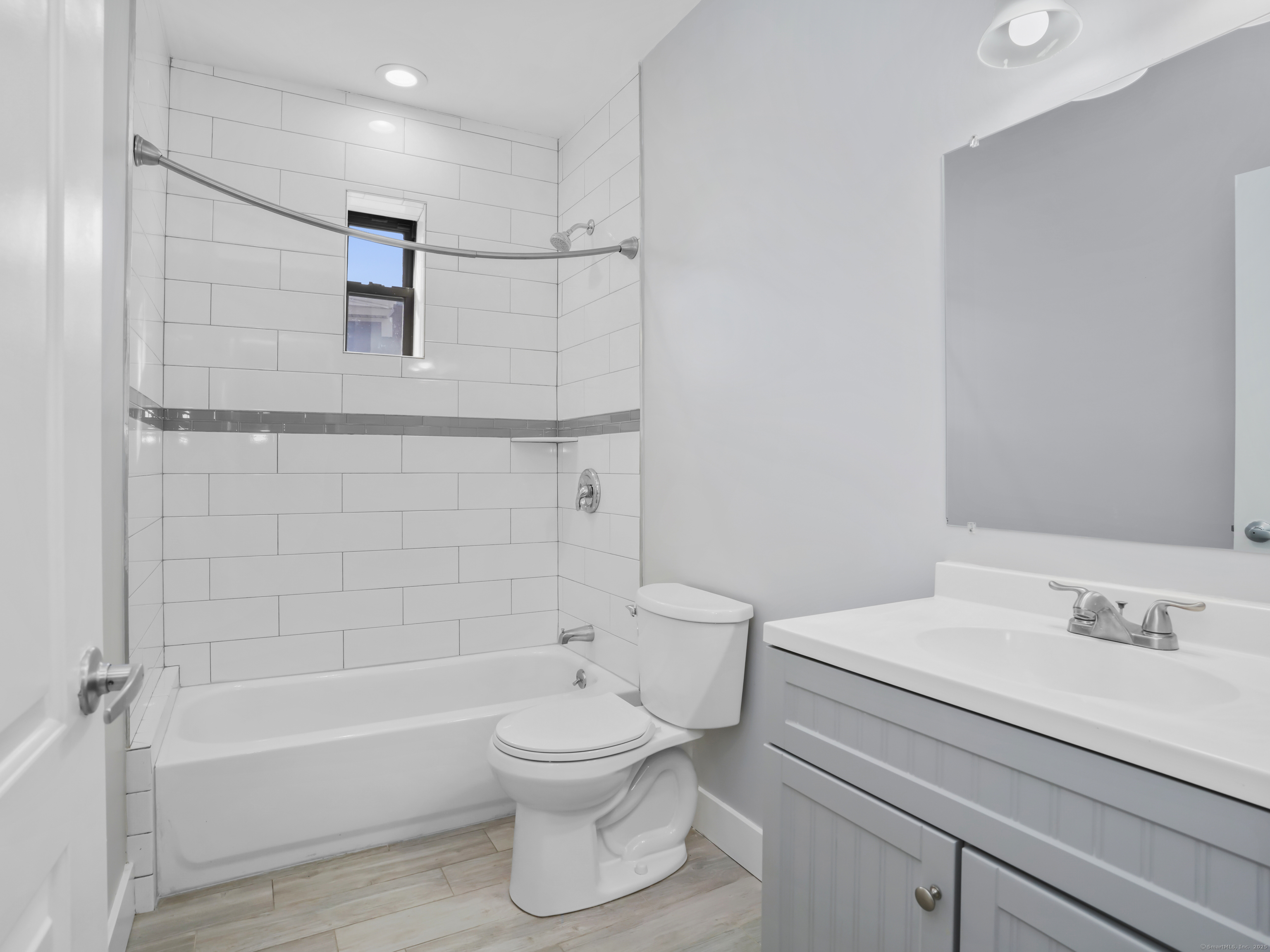 775 Atlantic Street, Unit R2 Stamford, CT 06902 - Photo 15 of 18 a bathroom with a sink toilet and shower