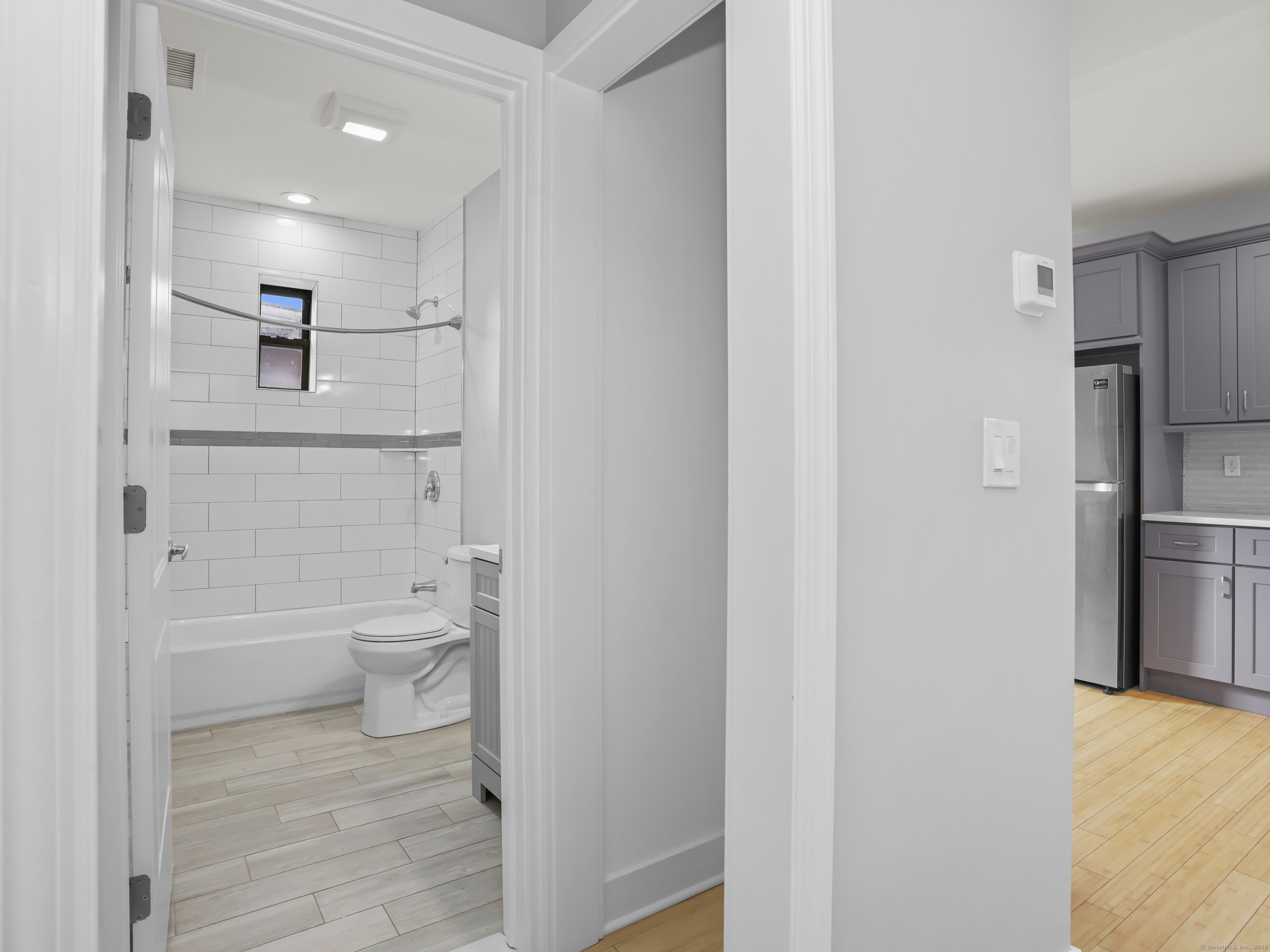 775 Atlantic Street, Unit R2 Stamford, CT 06902 - Photo 16 of 18 a bathroom with a toilet sink and shower