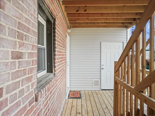 a view of a brick house with wooden floor and floor