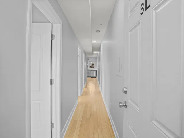 a view of a bathroom from the hallway