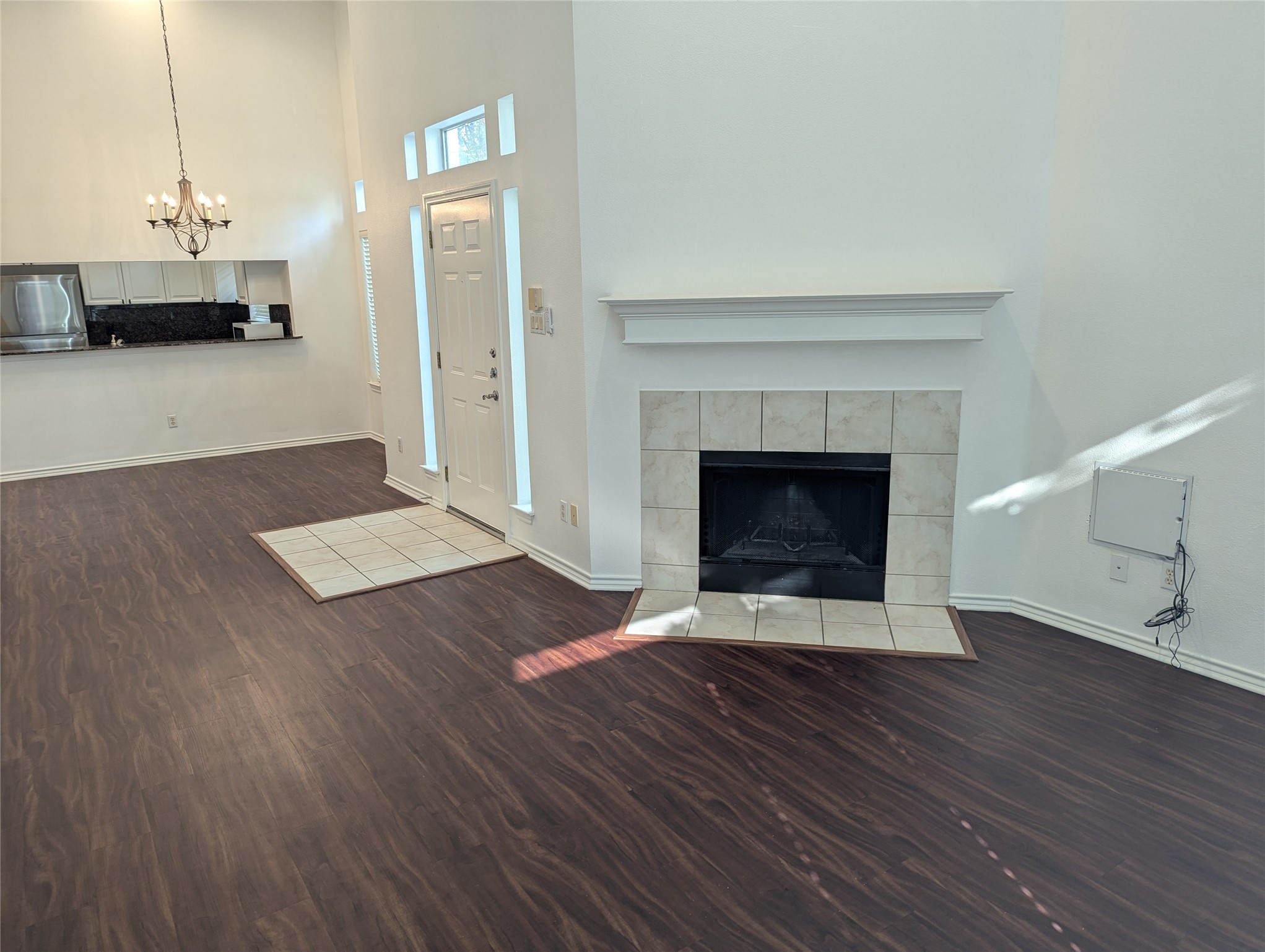 2918 Ranch Road 620 North, Unit Y194 Austin, TX 78734 - Photo 3 of 35 a living room with a fireplace and wooden floor