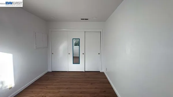 a view of a yard with potted plants