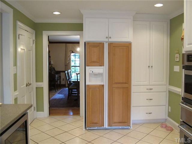 507 Spring Valley Drive Raleigh, NC 27609 - Photo 15 of 25 Kitchen has a large pantry and ample additional storage.