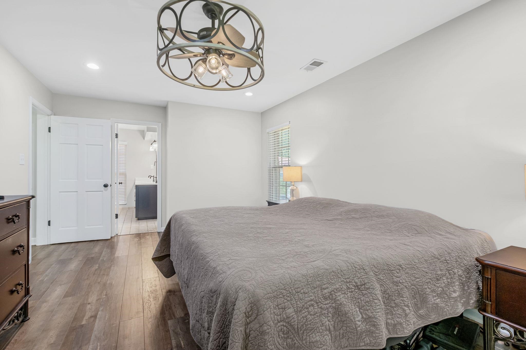 4729 Cedar Ridge Drive Millington, TN 38053 - Photo 18 of 40 Bedroom featuring wood-finish flooring, a decorative ceiling fan with integrated lighting, and recessed ceiling lights