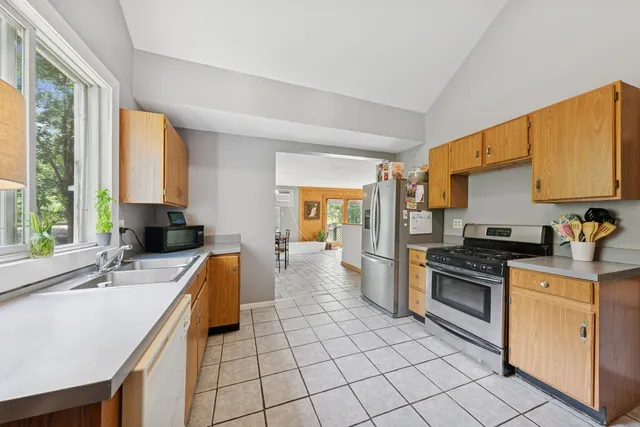a kitchen with a sink stove and cabinets