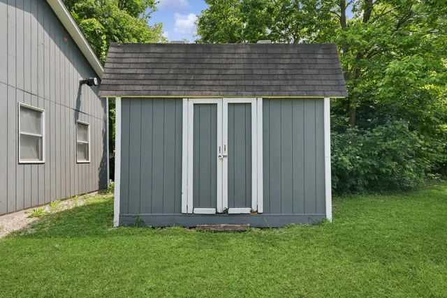 a view of a table and chairs in the garden
