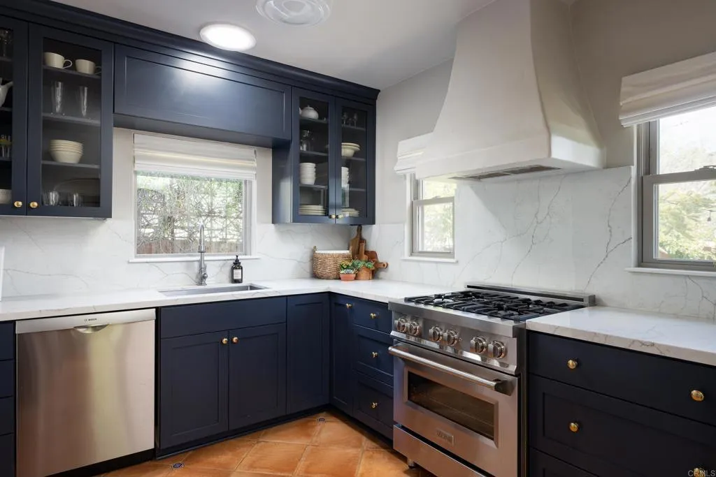 1603 Felton Street San Diego, CA 92102 - Photo 15 of 55 a kitchen with a stove a sink and a window