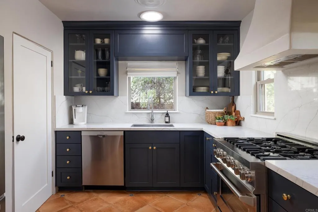 1603 Felton Street San Diego, CA 92102 - Photo 16 of 55 a kitchen with a sink stove and cabinets