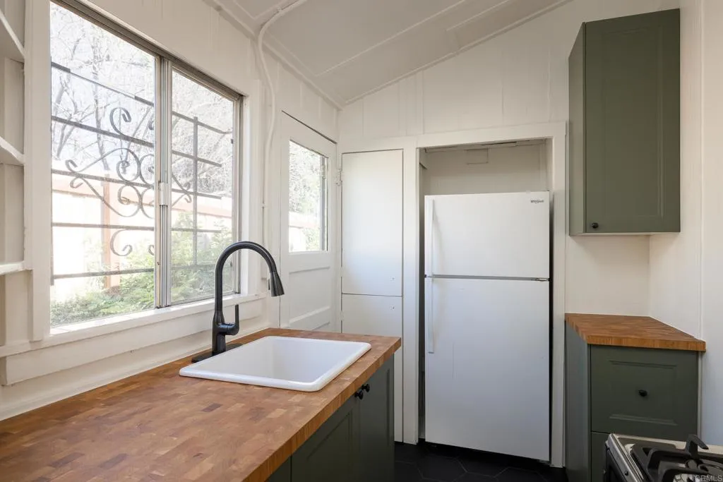 1603 Felton Street San Diego, CA 92102 - Photo 37 of 55 a kitchen with a refrigerator and a window