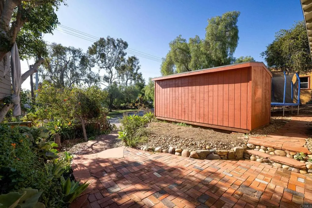 1603 Felton Street San Diego, CA 92102 - Photo 45 of 55 a view of a backyard with plants and large trees