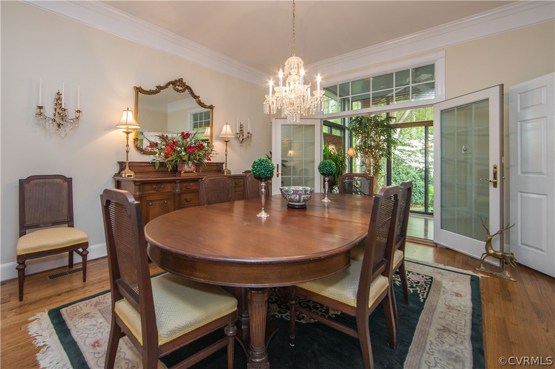 501 Rivers Bend Circle Chester, VA 23836 - Photo 9 of 36 a dining room with furniture a chandelier and window