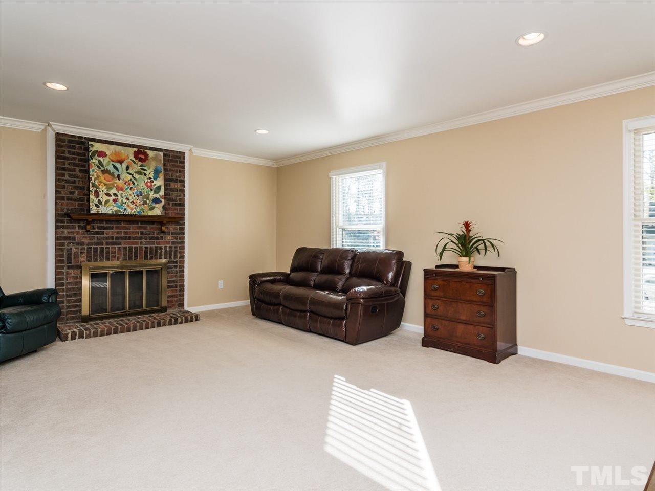 112 Trackers Road Cary, NC 27513 - Photo 11 of 25 The spacious family room has a masonry wood-burning fireplace.