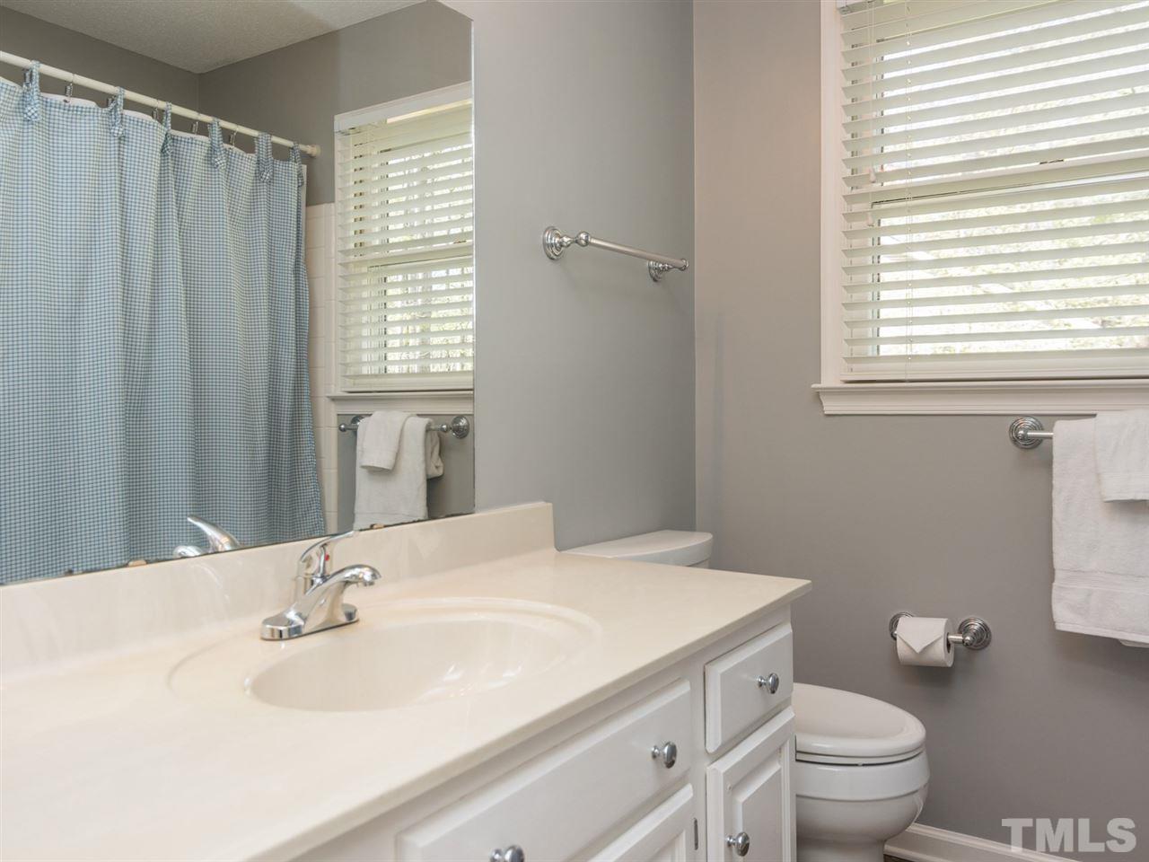 112 Trackers Road Cary, NC 27513 - Photo 18 of 25 This is the perfect bathroom for sharing. There is a tub/shower combination.